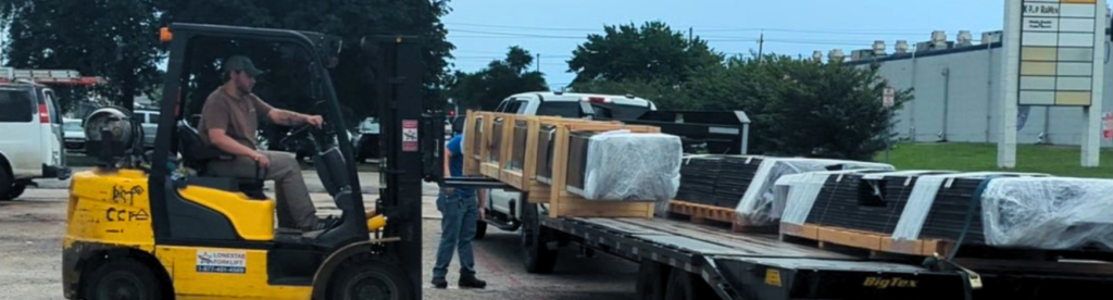 MRP Employees loading standing seam panels onto a customers trailer.